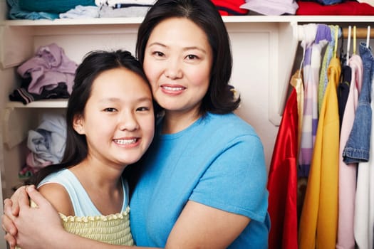 Portrait of a mother hugging her daughter
