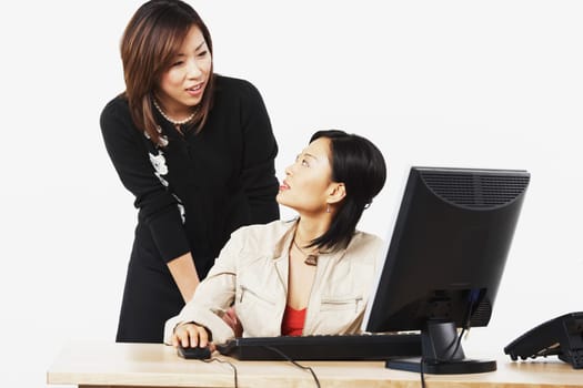 Close-up of two businesswomen looking at each other