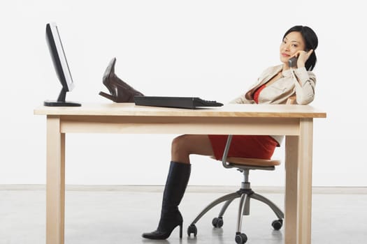 Portrait of a businesswoman talking on a cordless telephone