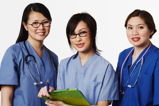 Portrait of three female doctors standing together
