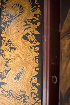 Close-up of a painting of a dragon in a temple