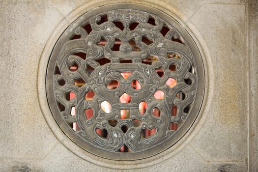 Close-up of a stone window of a temple