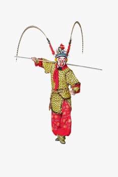 Male Chinese opera performer gesturing with a weapon