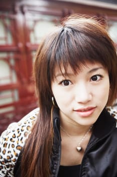 Close-up of a young woman looking away thinking