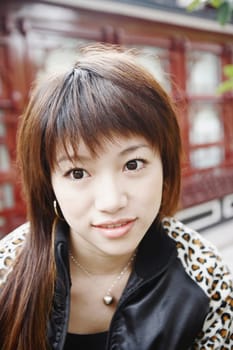 Close-up of a young woman looking away thinking
