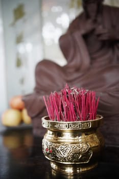 Close-up of incense sticks in a jar
