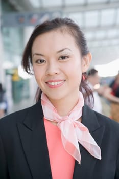 Close-up of a female cabin crew smiling