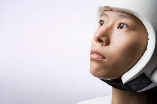 Close-up of a young woman wearing a sports helmet