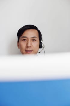 Portrait of a customer service representative behind a cubicle