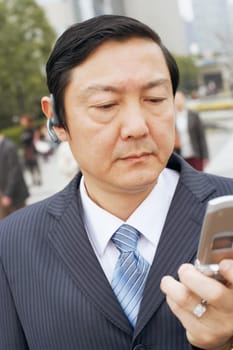 Close-up of a businessman using a mobile phone