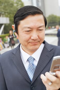 Close-up of a businessman using a mobile phone