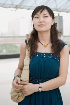 Portrait of a mid adult woman standing in a corridor