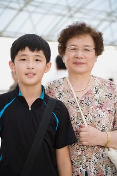 Portrait of a senior woman smiling with her grandson