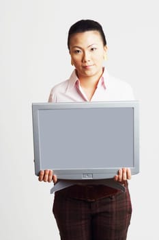 Portrait of a businesswoman holding the model of a computer monitor with progress reports