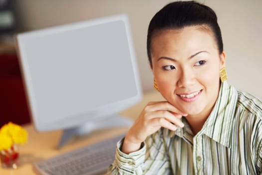 Close-up of a businesswoman looking sideways and smiling