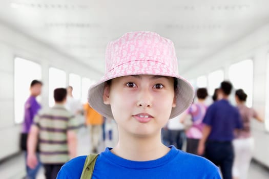 Portrait of a young woman in a corridor