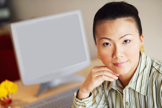 Portrait of a businesswoman thinking with her hand under her chin