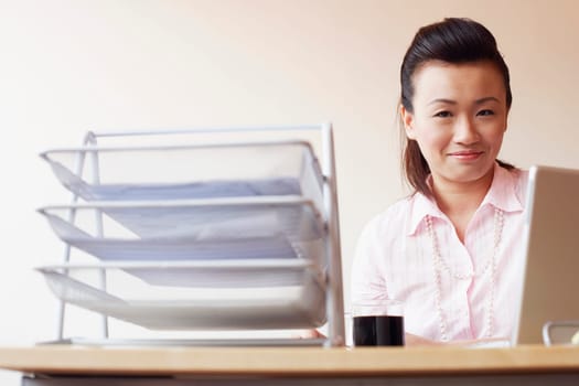 Portrait of a businesswoman sitting in an office and smiling
