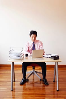 Businessman using a laptop in an office