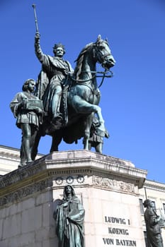 The monument to Ludwig I. King of Bavaria in Munich made of bronze. The equestrian monument was ceremoniously unveiled in 1862 at Odeonsplatz. The rider with a raised sceptre is accompanied by pages who symbolize the virtues of "justice"" and"