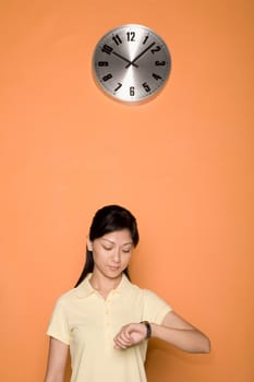 Female office worker checking the time
