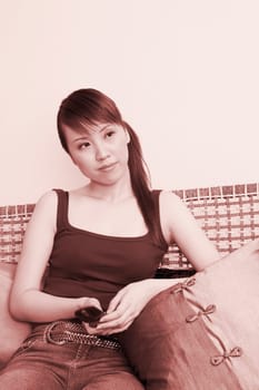 Young woman holding a mobile phone