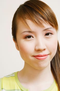 Portrait of a young woman smirking