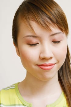 Close-up of a young woman with her eyes closed