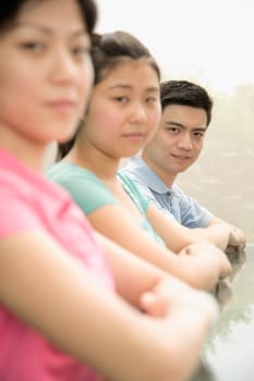 Portrait of three office workers sitting in a conference room