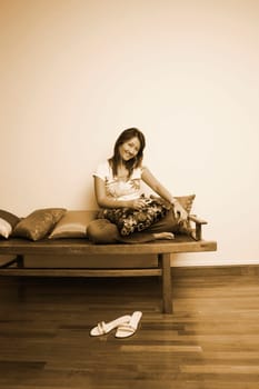 Portrait of a young woman listening to an MP3 player