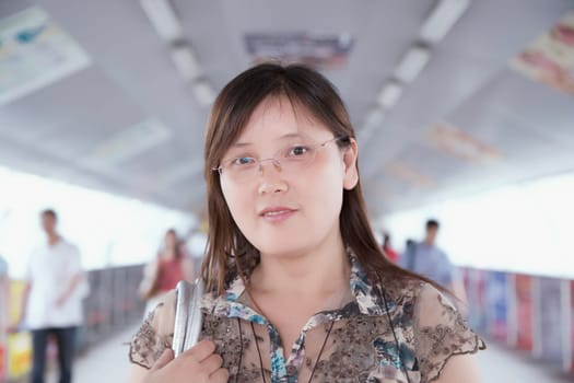 Portrait of a mid adult woman in a corridor
