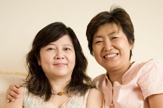 Portrait of two mature women smiling