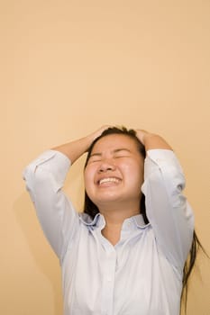 Close-up of a young woman suffering from a headache