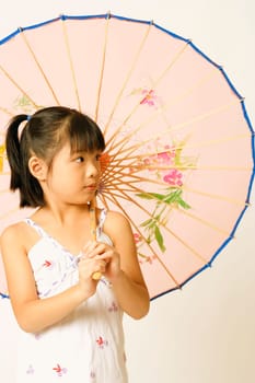 Close-up of a girl holding a parasol