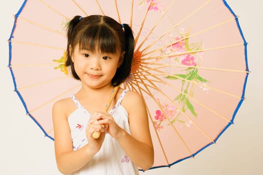 Portrait of a girl holding a parasol