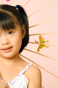 Close-up of a girl with a parasol