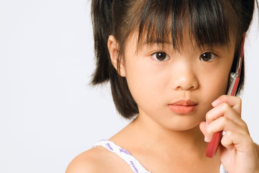 Portrait of a girl holding a mobile phone