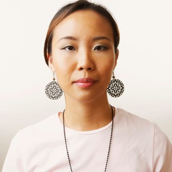 Portrait of a young woman wearing a necklace