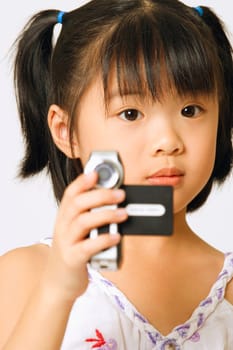Portrait of a girl holding a home video camera