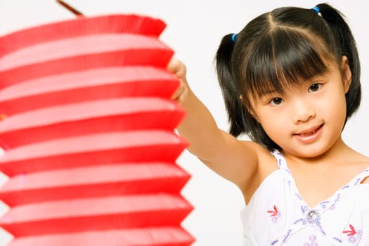 Portrait of a girl holding a Chinese lantern