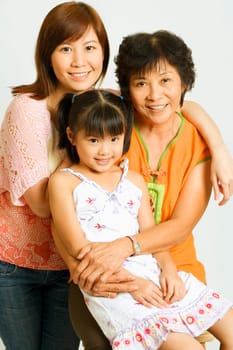 Portrait of a mature woman with her daughter and her granddaughter