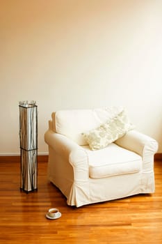 Close-up of an armchair on a wooden floor