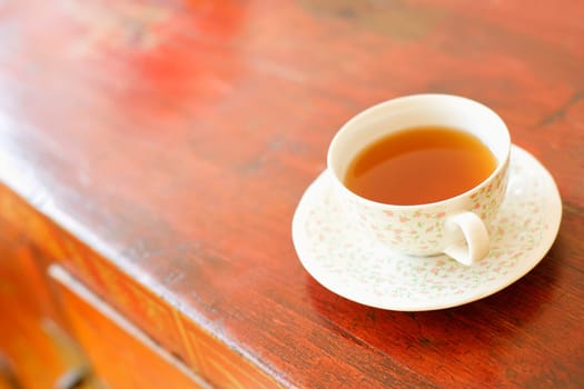 Close-up of a cup of coffee on a cabinet