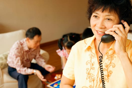 Close-up of a mature woman talking on the telephone