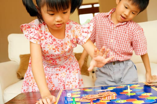 Close-up of a boy playing with his sister