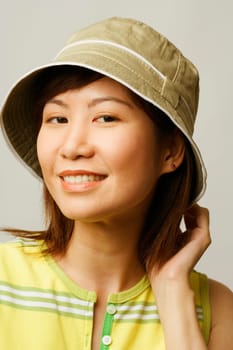 Close-up of a young woman wearing a hat
