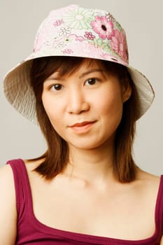 Portrait of a young woman wearing a hat