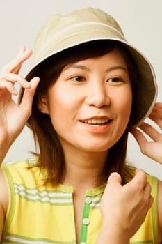Close-up of a young woman wearing a hat