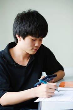 Close-up of a boy holding calculator
