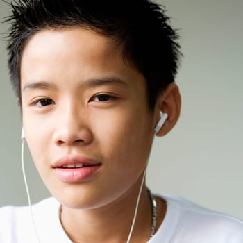 Portrait of a boy listening to headphones